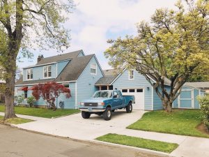 suburban driveway with ford pickup truck